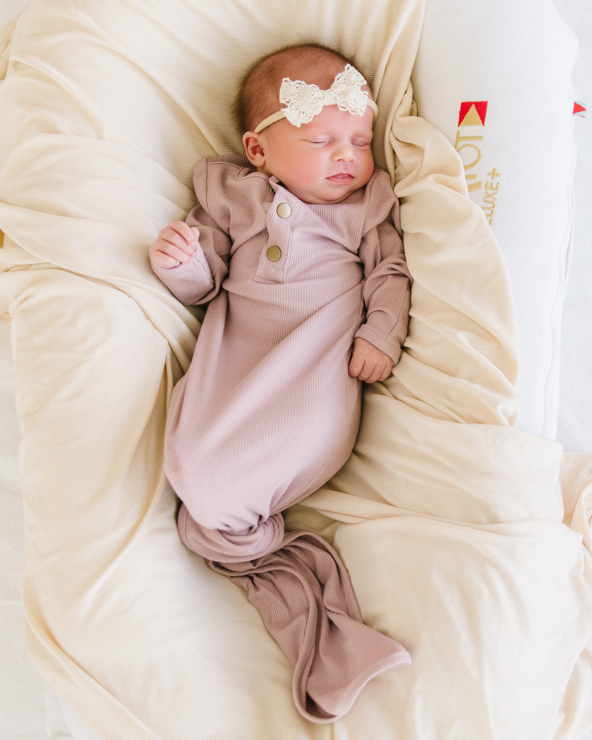 knotted baby gown