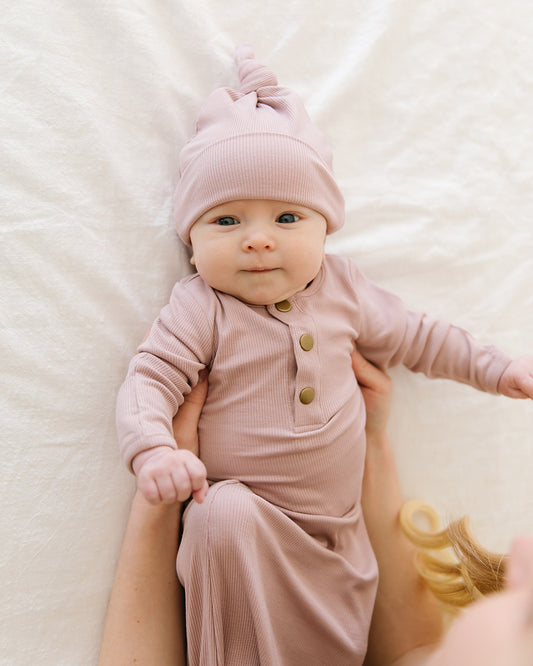 blush ribbed top knot baby hat