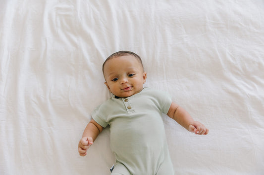 green ribbed baby romper