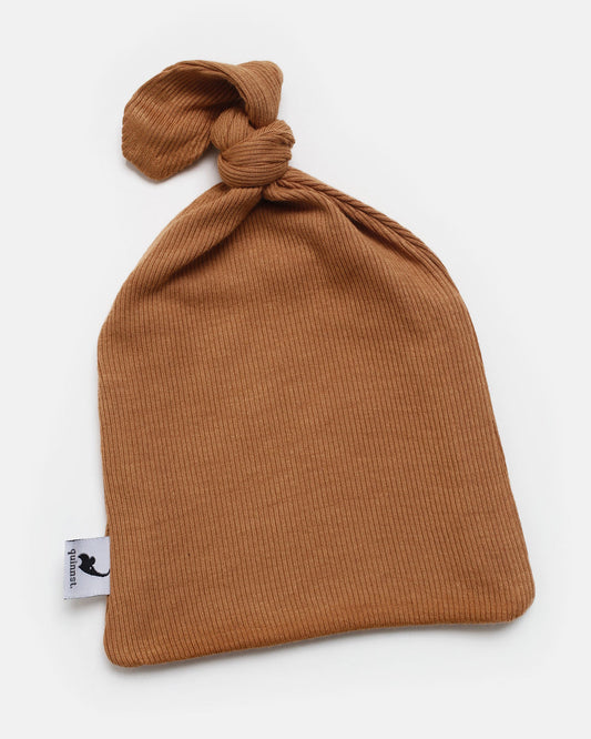 camel ribbed top knot hat